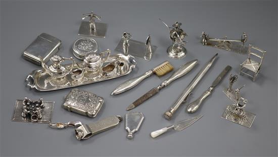 Assorted silver etc. including Dutch white metal figures, a miniature tea set & tray, cigar cutter , bookmark and two vesta cases